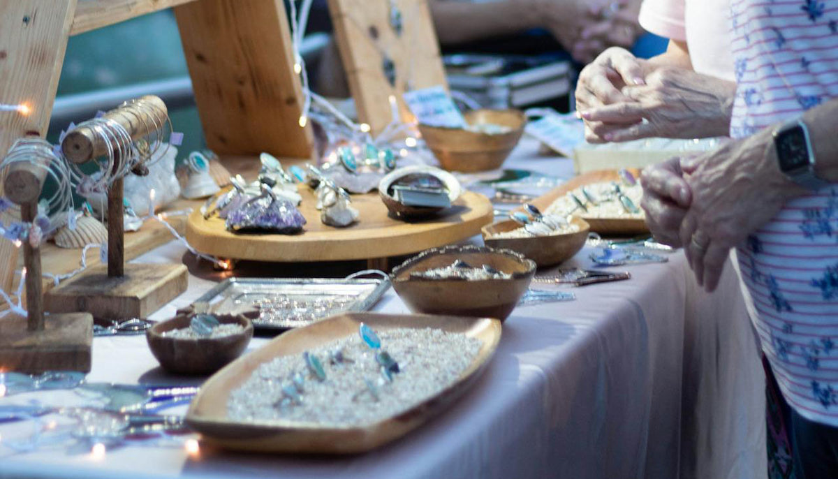 fashion jewelry on display in a jewelry booth in a night market