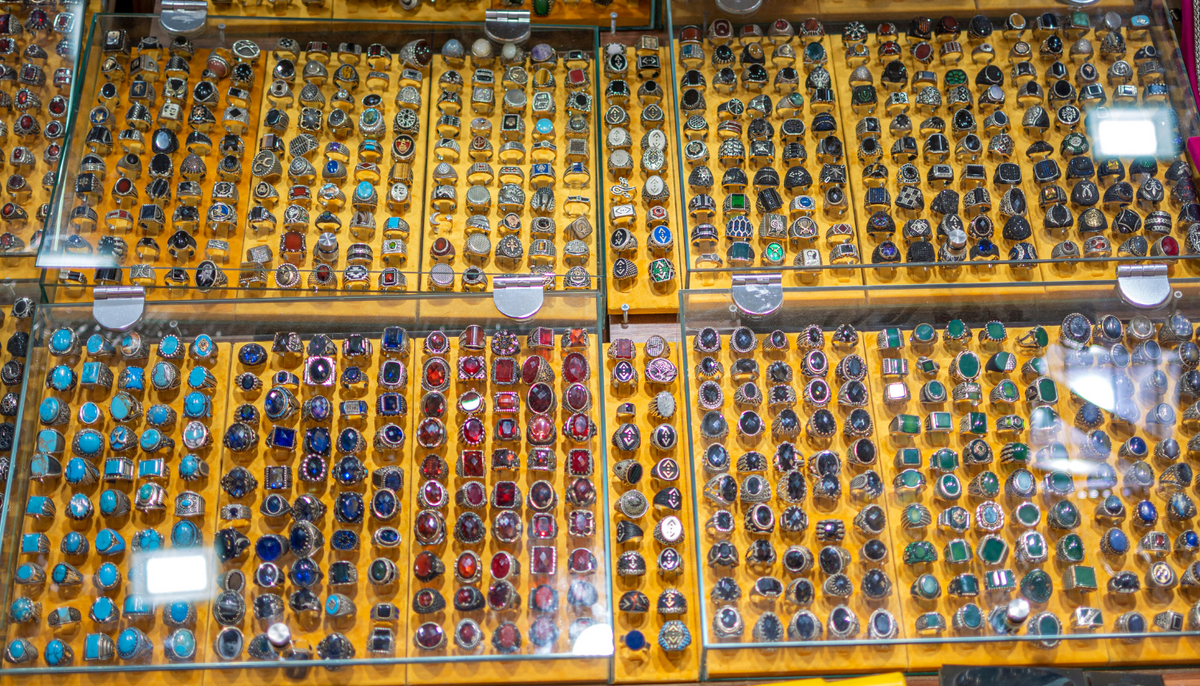 fashion rings in a glass display in a jewelry shop