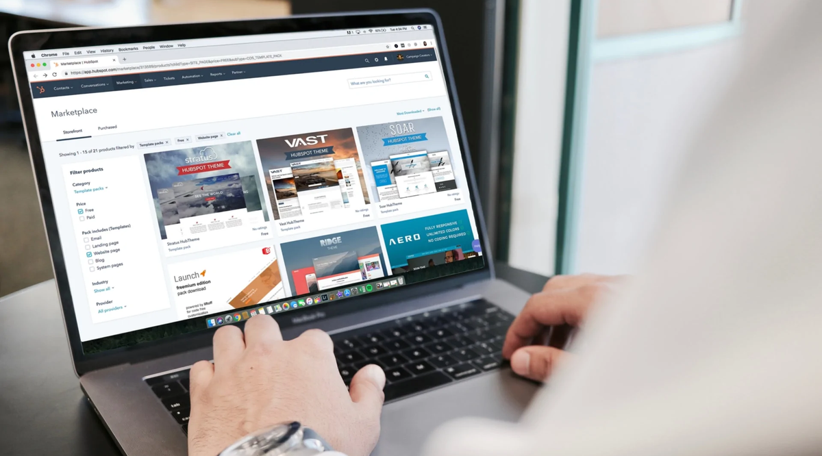 person typing on a laptop with the screen in an e-commerce store