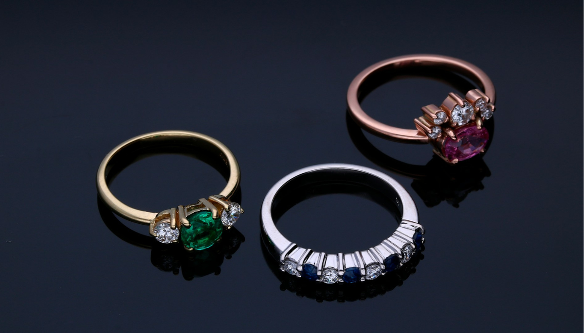 3 fashion rings on black background
