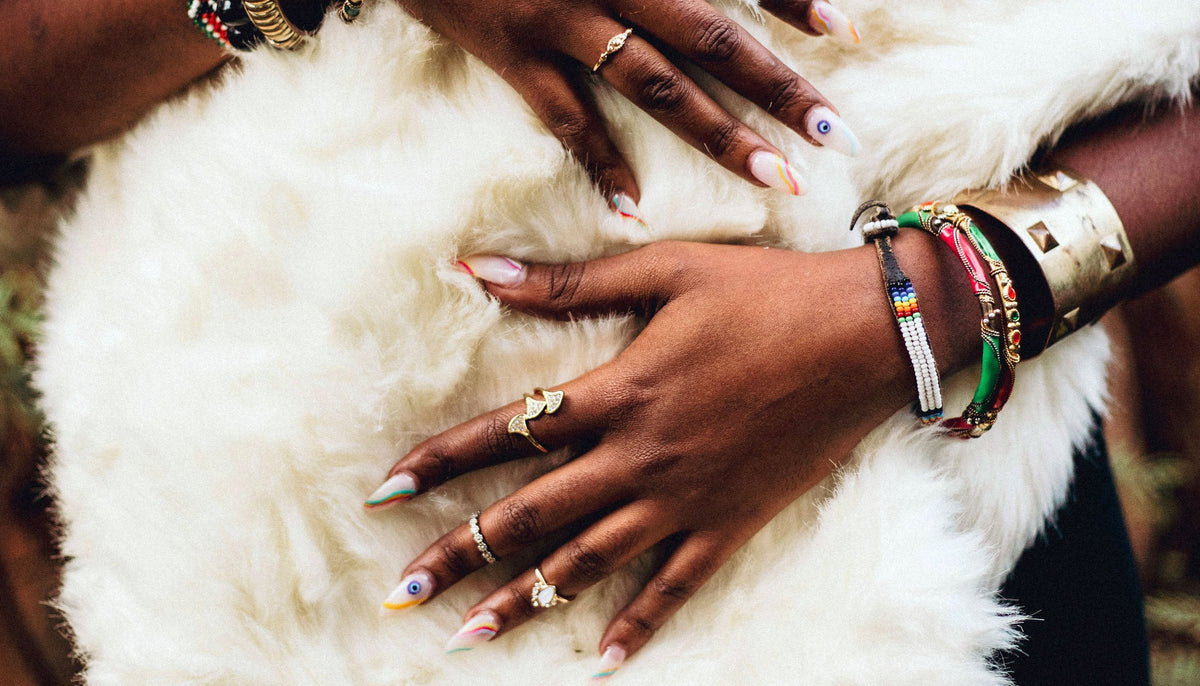 woman wearing gold tone and silver tone fashion rings