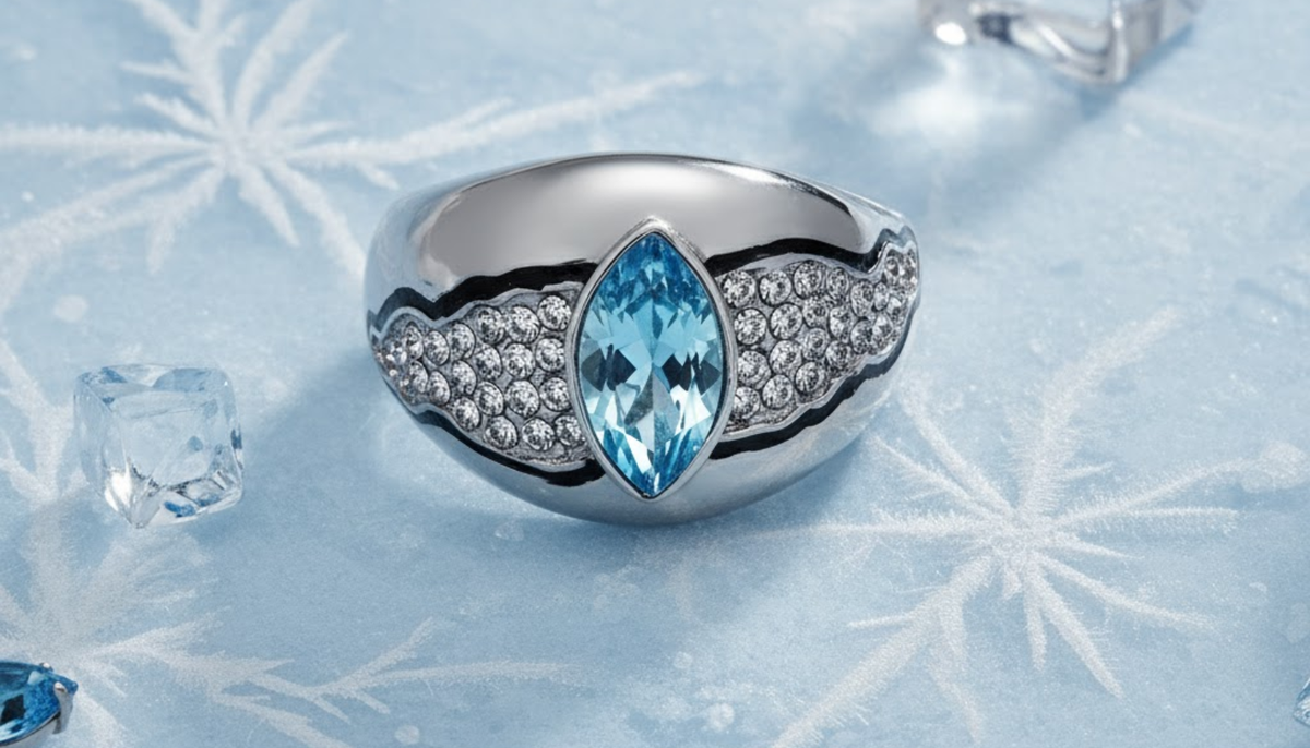 CJG1060 Wholesale Aquamarine Marquise Cut Top Grade Crystal High Polished Stainless Steel Ring on a light blue surface with snowflakes and other winter elements