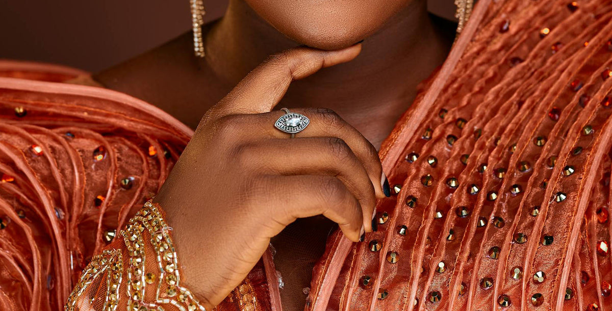 Elegant Portrait of a Woman in Exquisite Attire and Wearing a Marquise Sterling Silver Ring