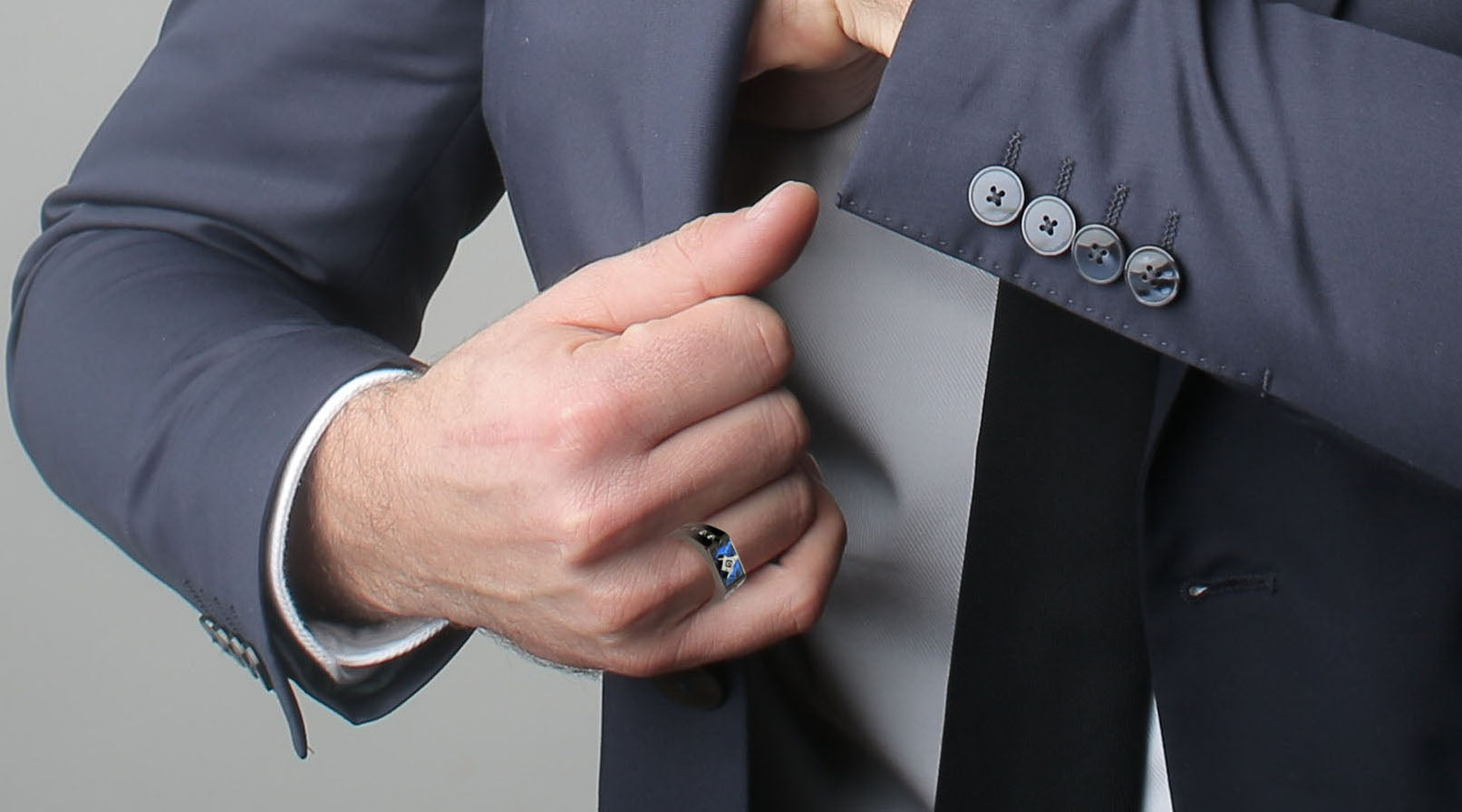 man in a suit wearing black-plated stainless steel masonic ring 