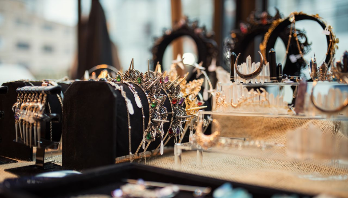 Close-up of exquisite jewelry display including necklaces and crowns, capturing elegance and glamour
