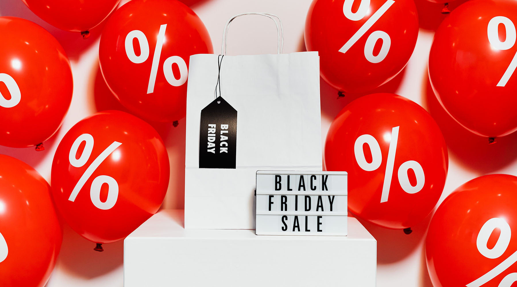 red-and-white-balloons-with-sign-that-says-black-friday-sale